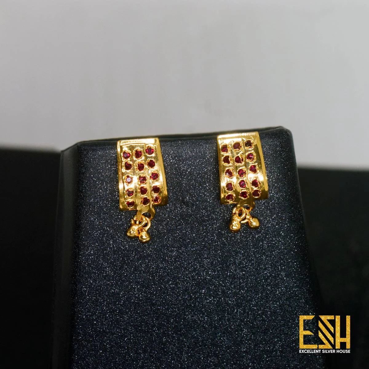 Gold plated Ladies Shield Theme Earring With pink stone