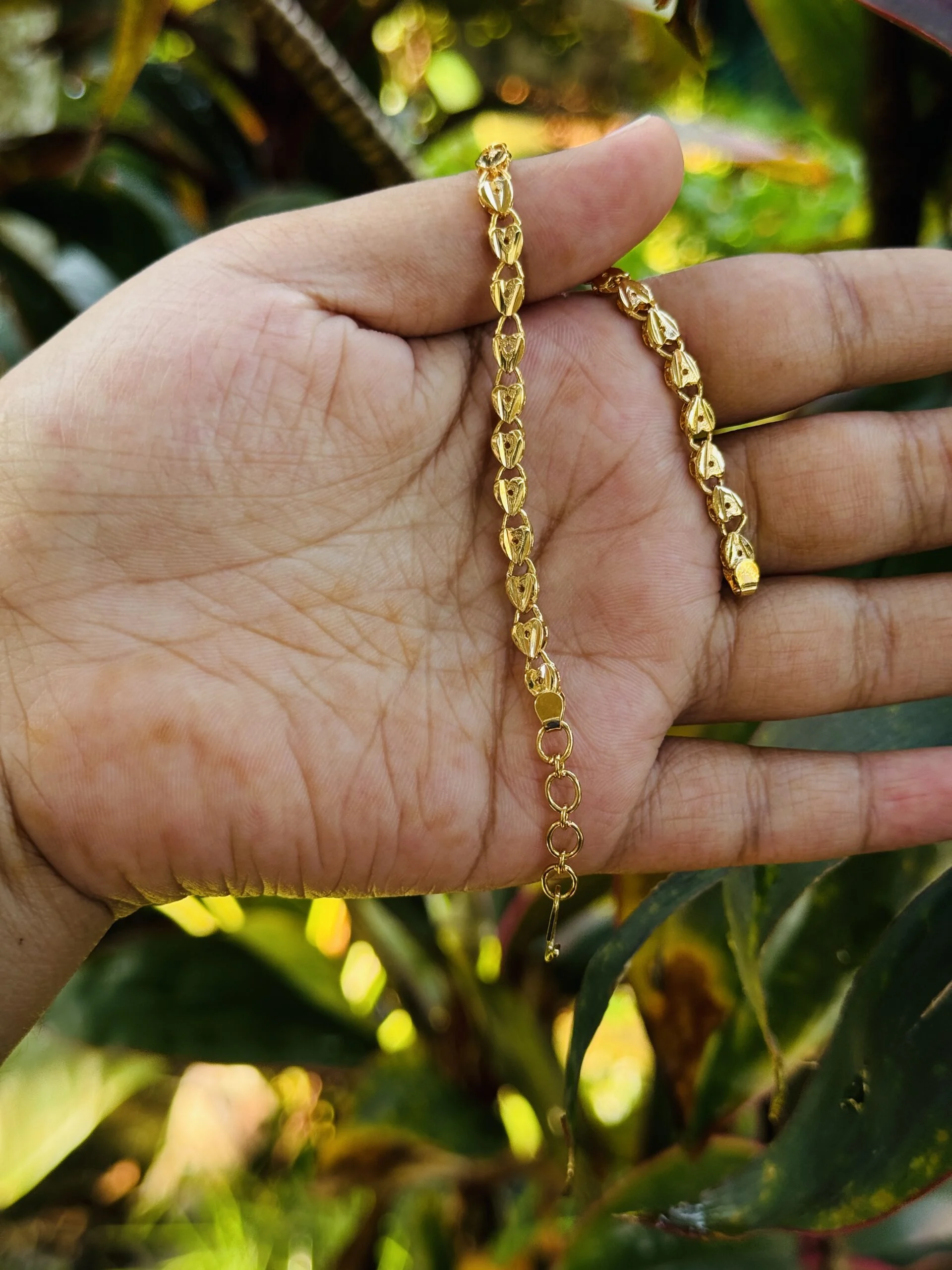 Gold plated stylish rich look 4 mm Singapore design bracelet with crosscut for girl and women.