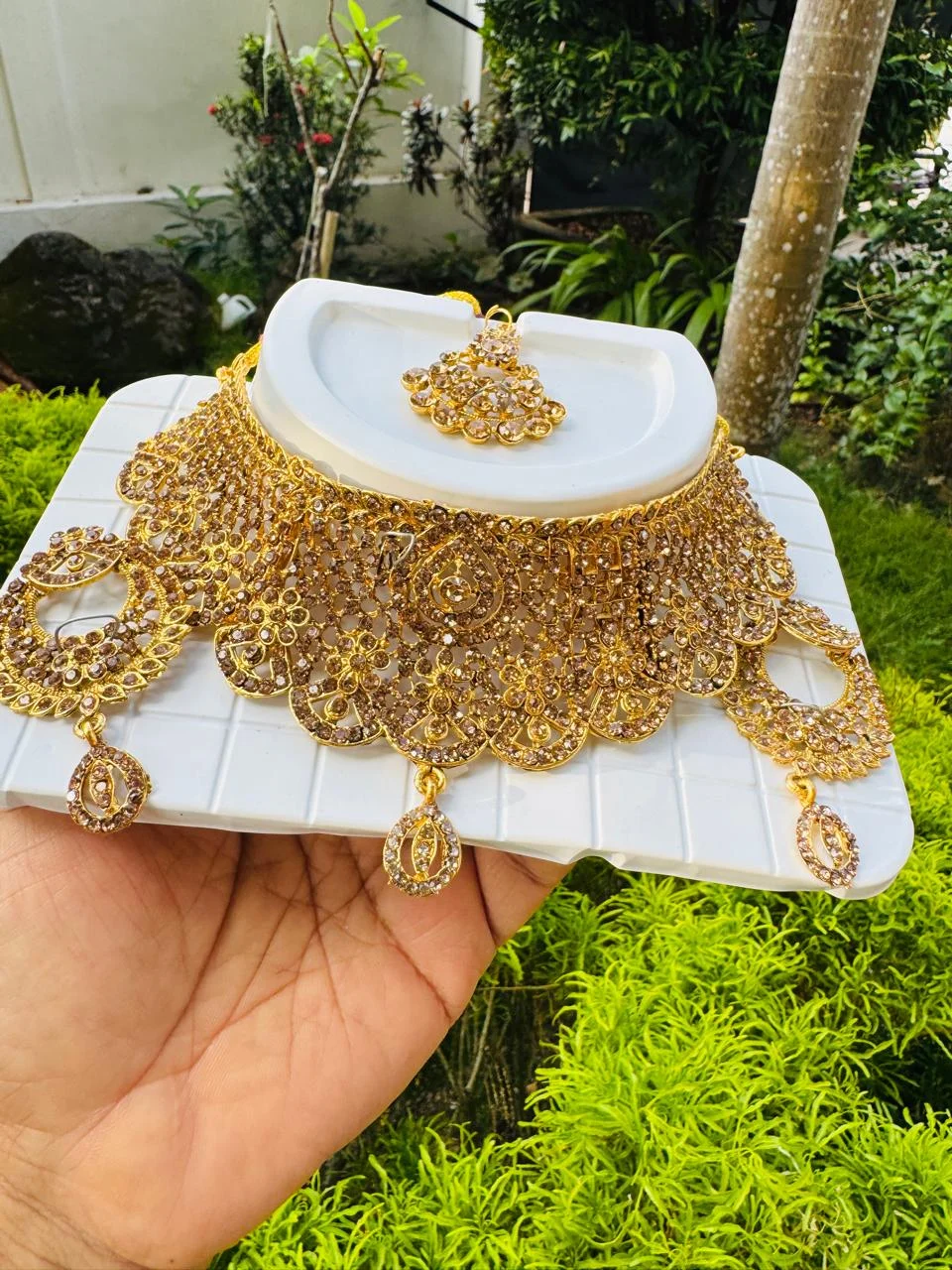 High Quality rich look Gold choker necklace and one pair earring, one nalal theli/frontlet with full gold stones for girls and women's